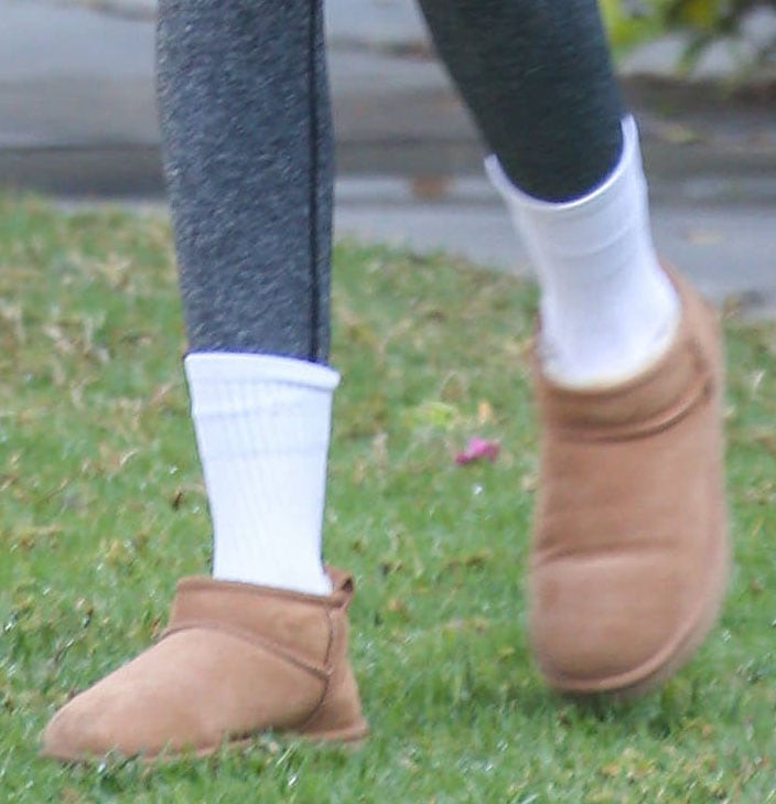 Kaia Gerber teams her Pilates outfit with UGG Classic Ultra Mini boots and white socks