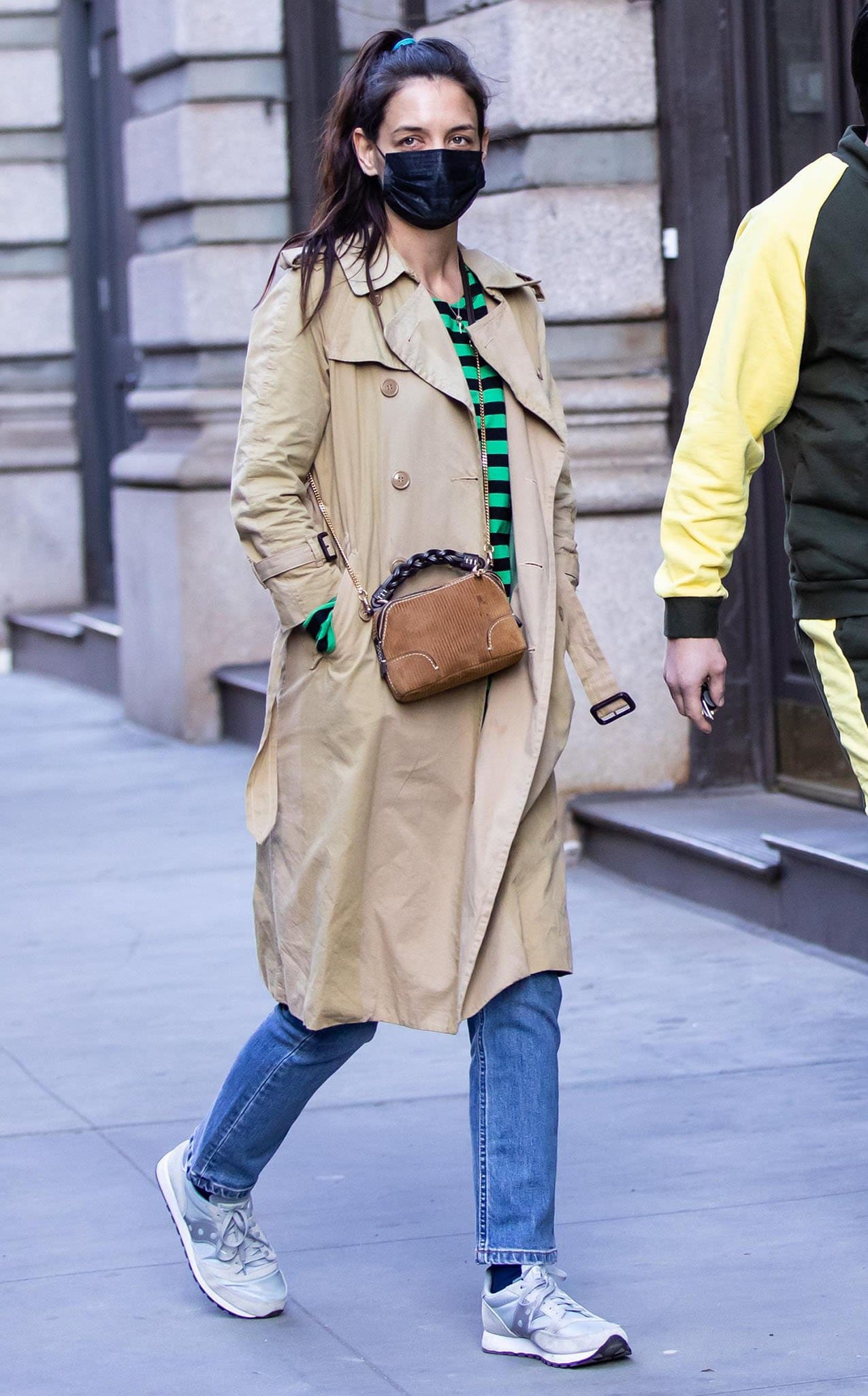 Katie Holmes steps out in a camel-colored coat with a black-and-green striped top and blue jeans
