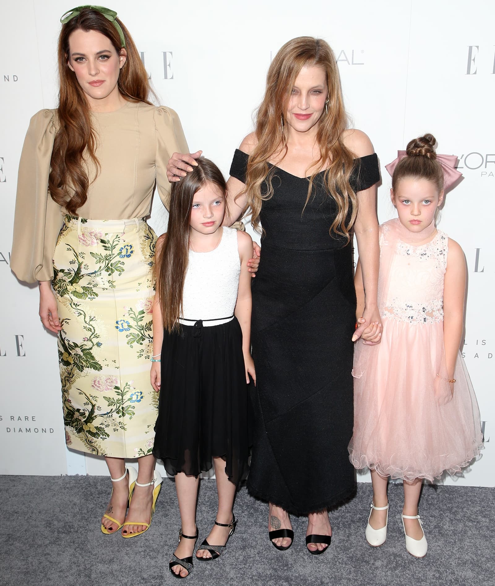 Lisa Marie Presley posing with Riley Keough and her twin girls Finley Aaron Love Lockwood and Harper Vivienne Ann Lockwood at the 2017 ELLE Women in Hollywood Awards