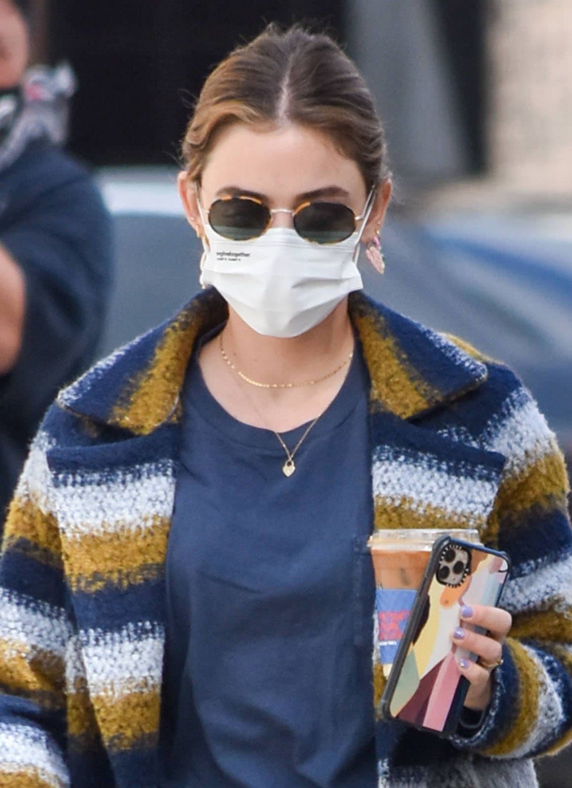 Lucy Hale accessorizes with Uncommon James earrings and stays safe with EvolveTogether face mask