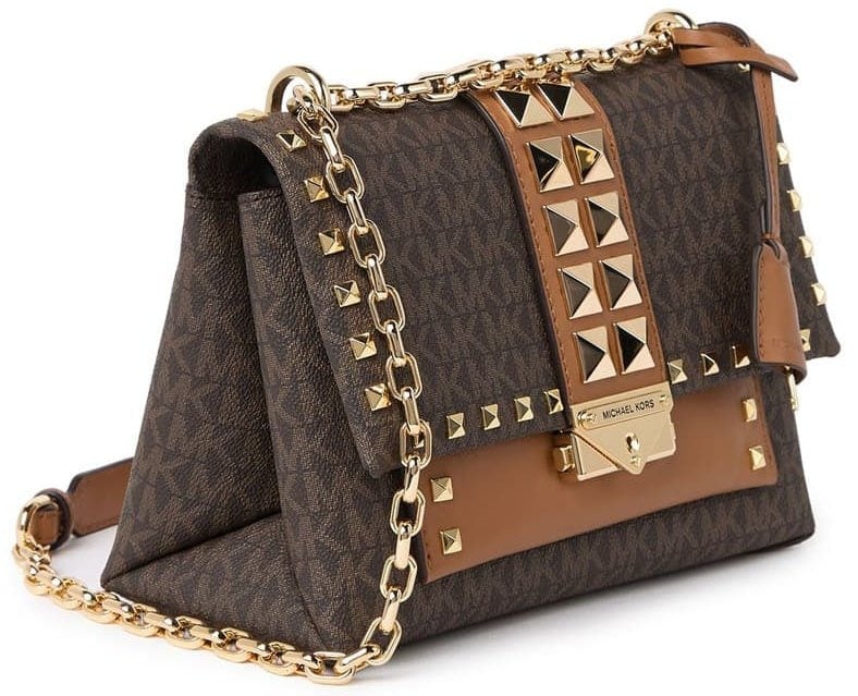 Pyramid studs add sophisticated edge to the logo-printed smooth leather exterior of the Cece crossbody bag