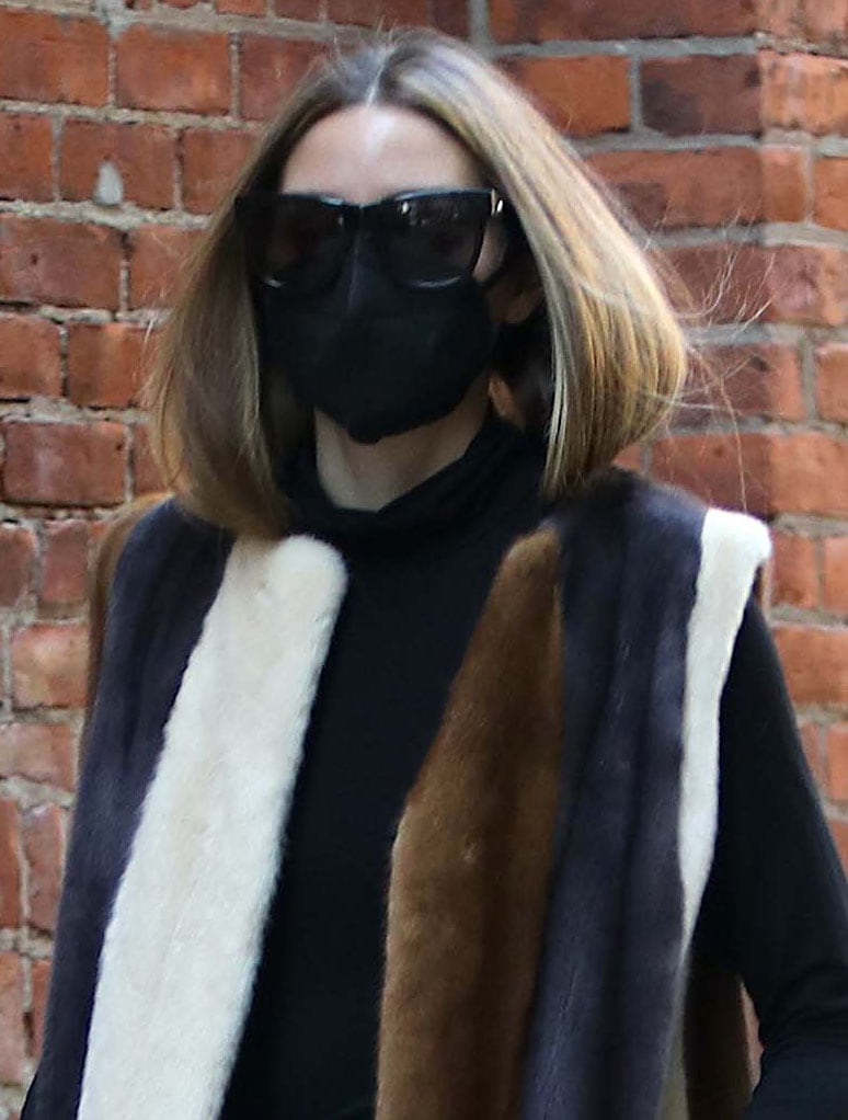 Olivia Palermo hides her eyes in a pair of Le Specs sunglasses