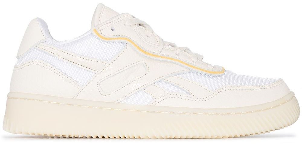 This shoe collaboration between Victoria Beckham and Reebok features a mesh and leather upper with contrasting yellow piping