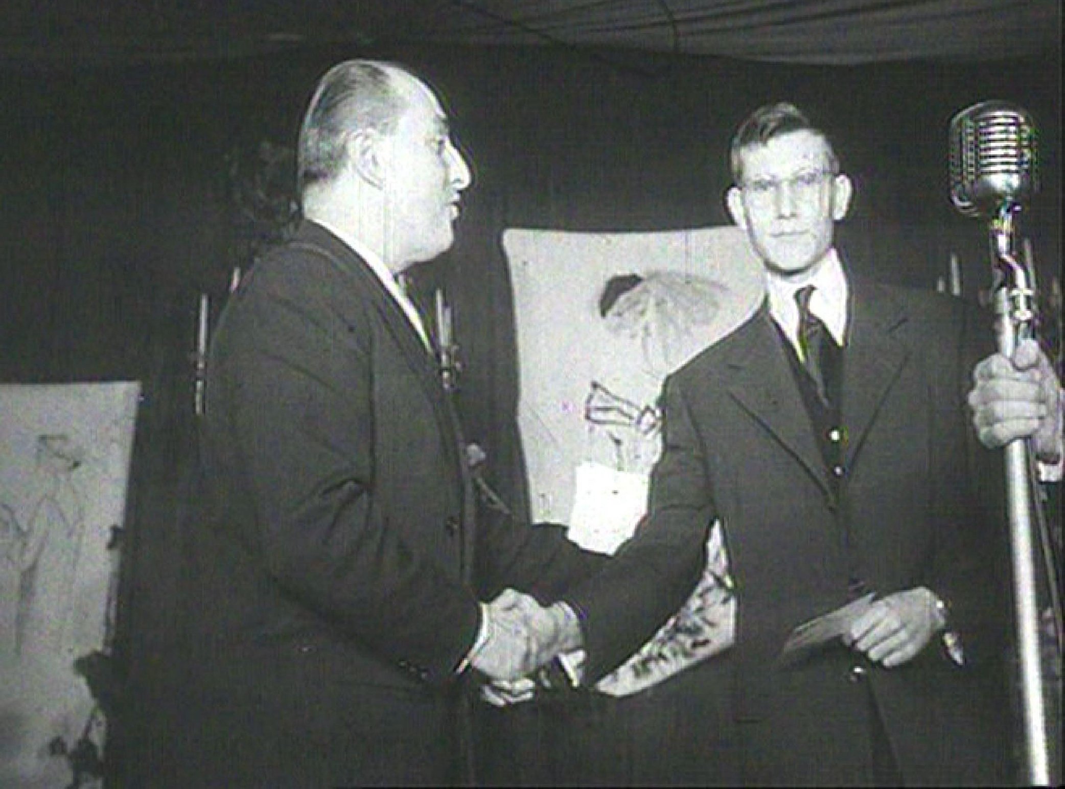 Yves Saint Laurent is introduced at a press conference at the Christian Dior salon in 1957