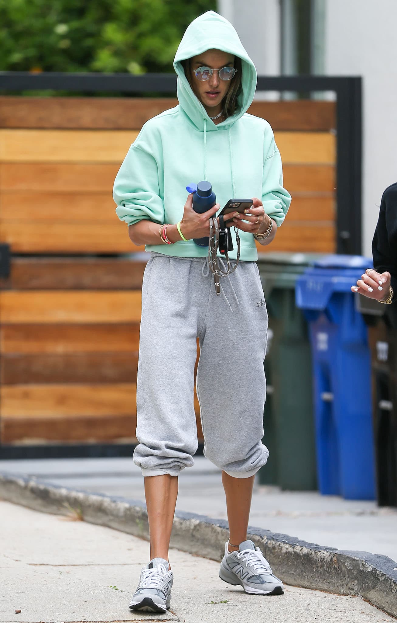 Alessandra Ambrosio goes to Pilates in a mint green hoodie with gray leggings on April 13, 2021