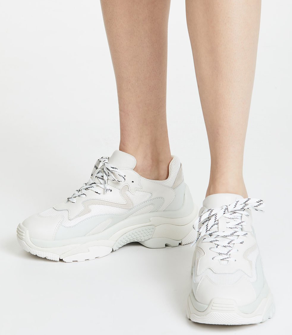 The trendy Ash Addict sneakers come with chunky soles, lace-up ties, and contrast panelling