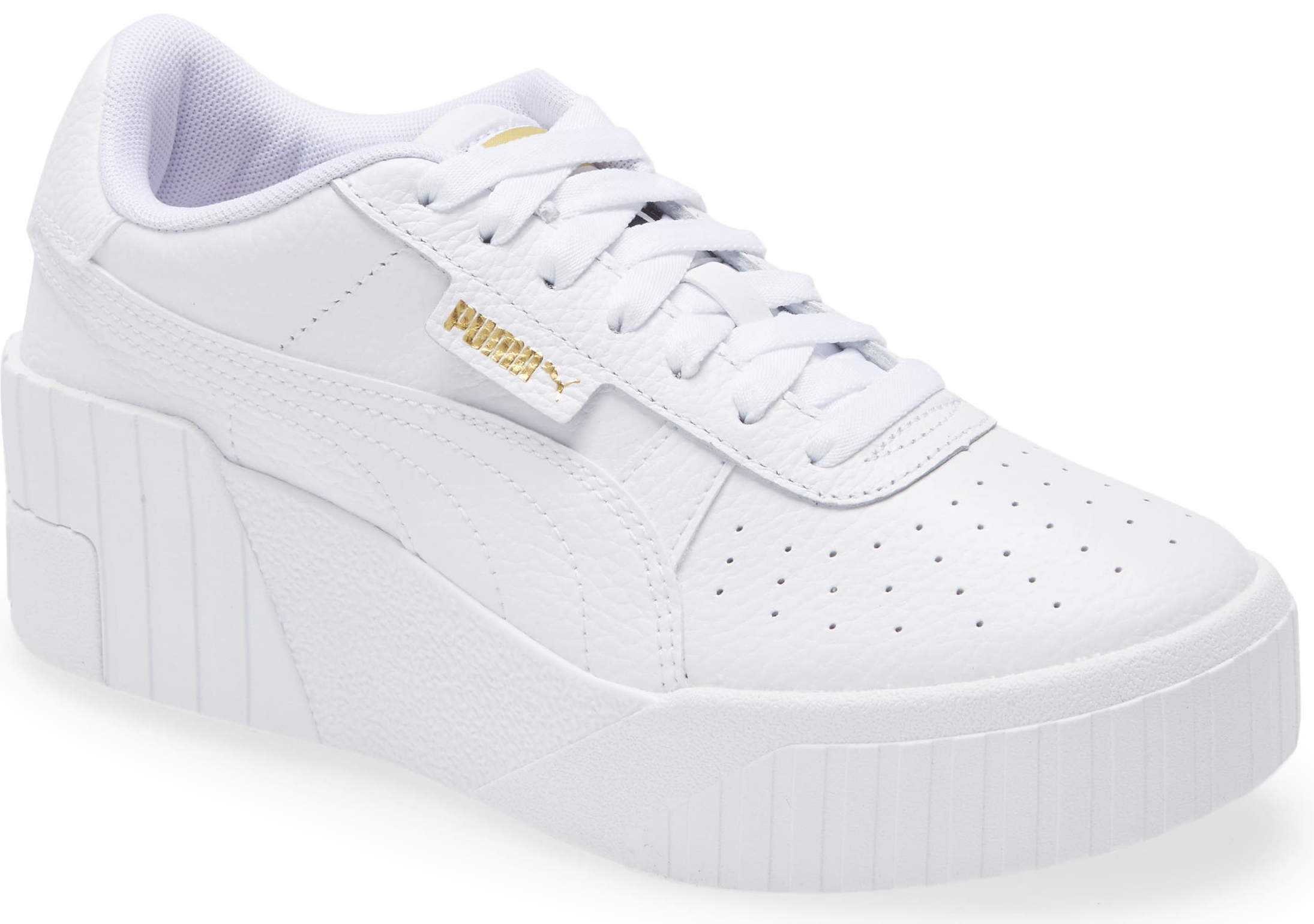 A hidden wedge ramps up the modern kick of an '80s-throwback street sneaker that pairs optic-white pebbled leather with an inky logo grounding the heel