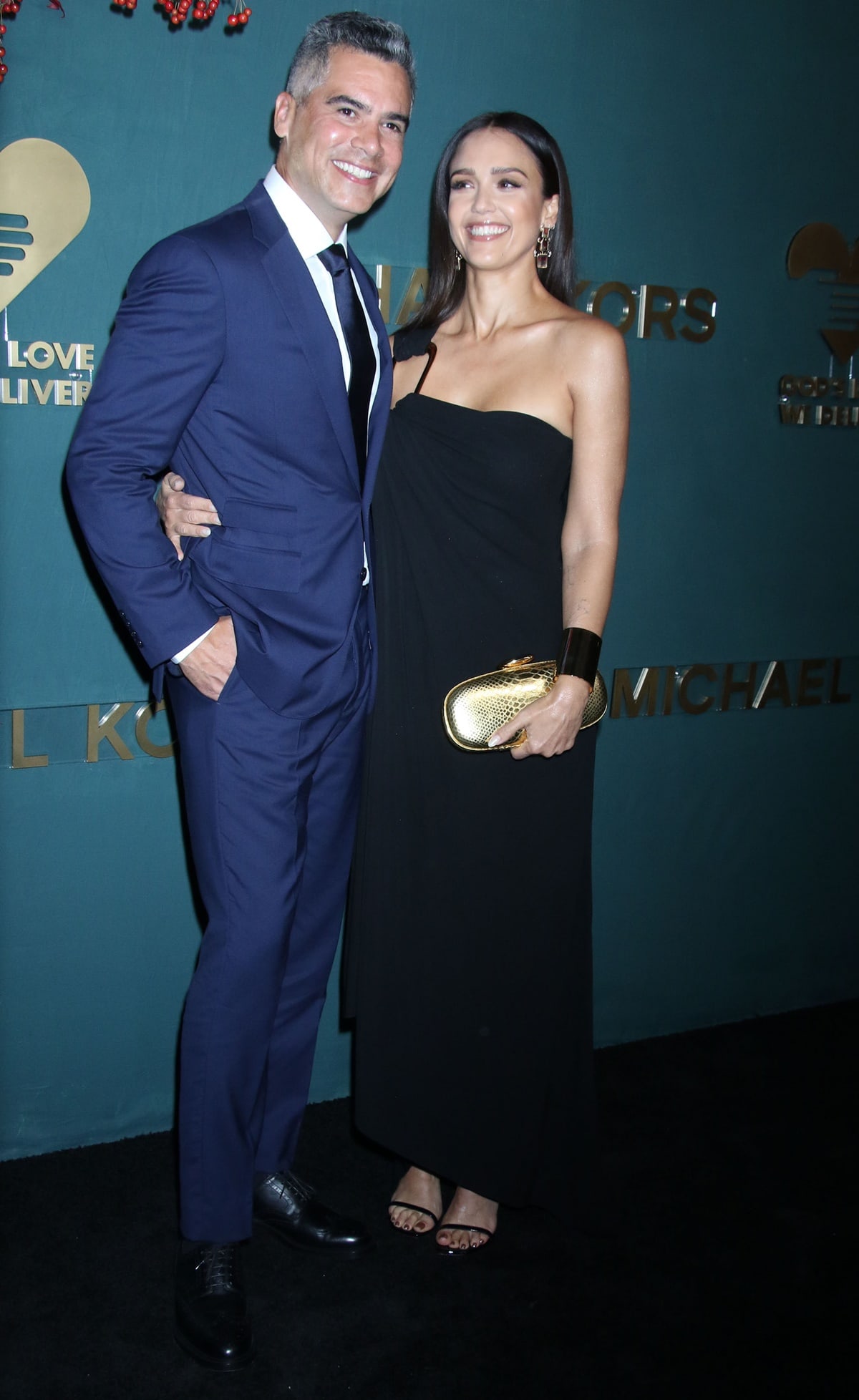 Jessica Alba, in a black strapless Michael Kors Collection gown, and her husband Cash Warren attend God's Love We Deliver 16th Annual Golden Heart Awards