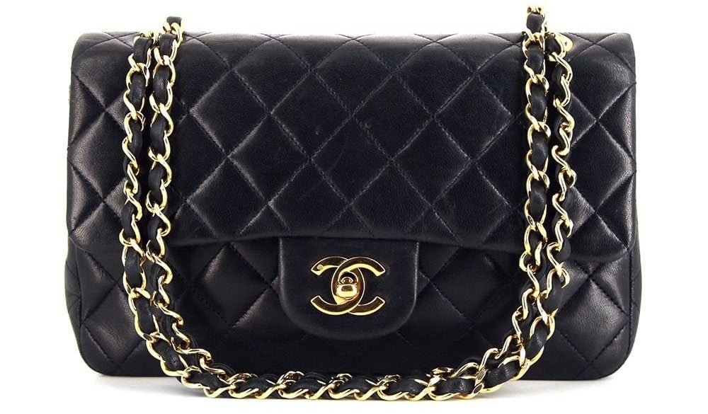 A timeless classic flap bag from 1991 that features the Chanel interlocking CC turn-lock closure