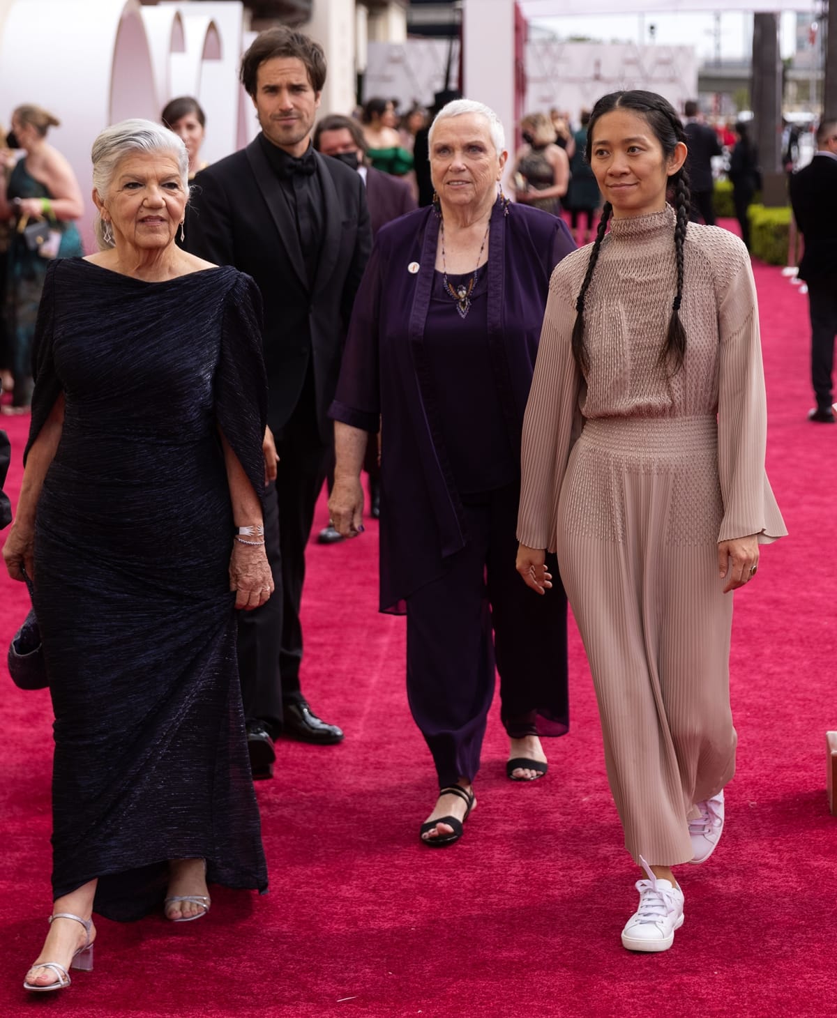 Chloe Zhao walked the red carpet in a beaded Hermès dress and white sneakers