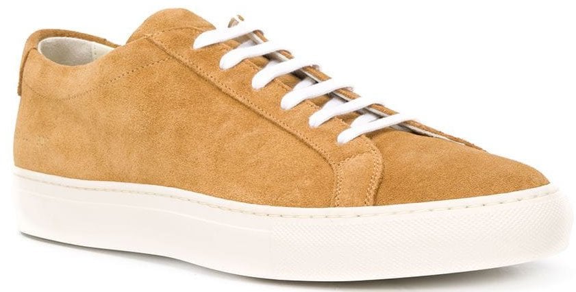 Common Projects' Achilles shoes feature a classic low-top silhouette with a tan suede upper