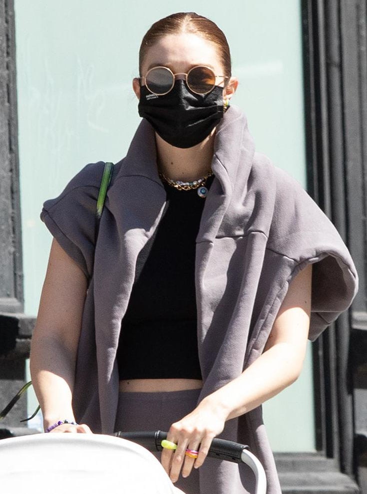 Gigi Hadid styles her athleisure with multiple multicolored The Last Line earrings and Keane rings