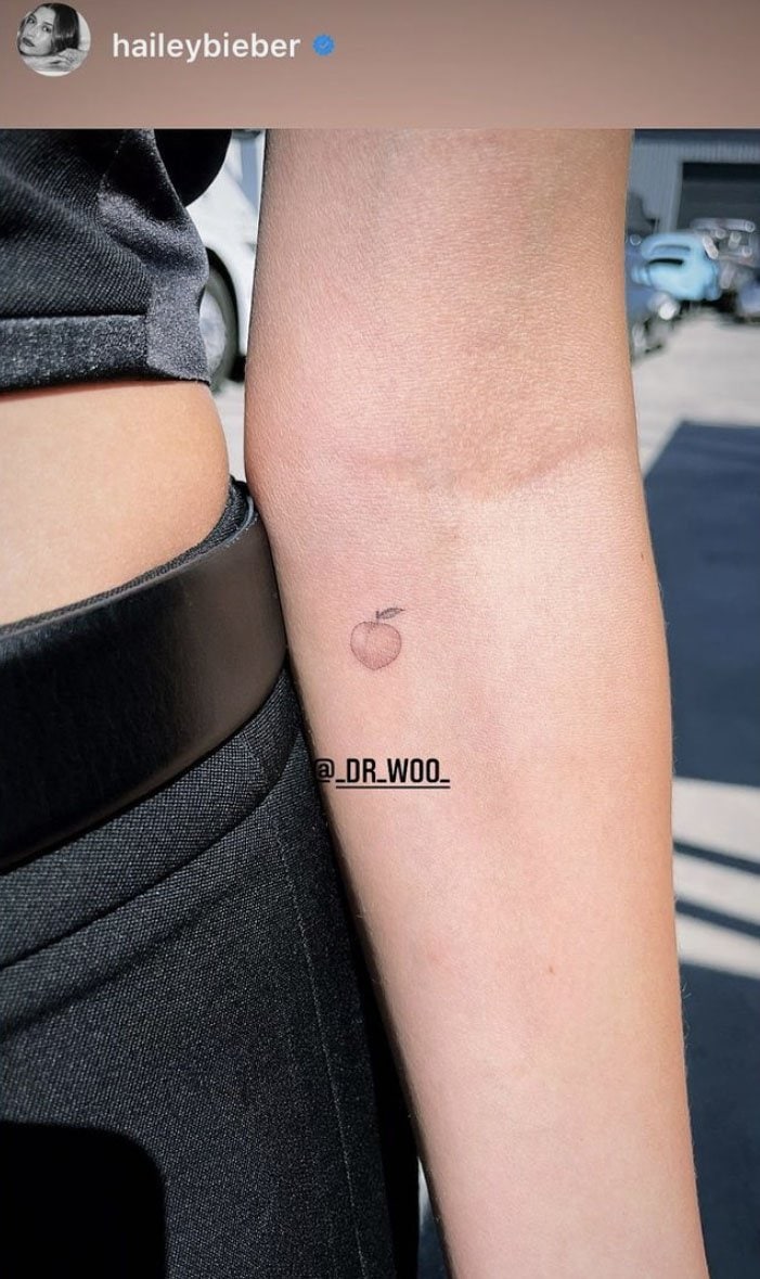 Gigi Hadid shares a photo of her new peach forearm tattoo on Instagram on March 29, 2021