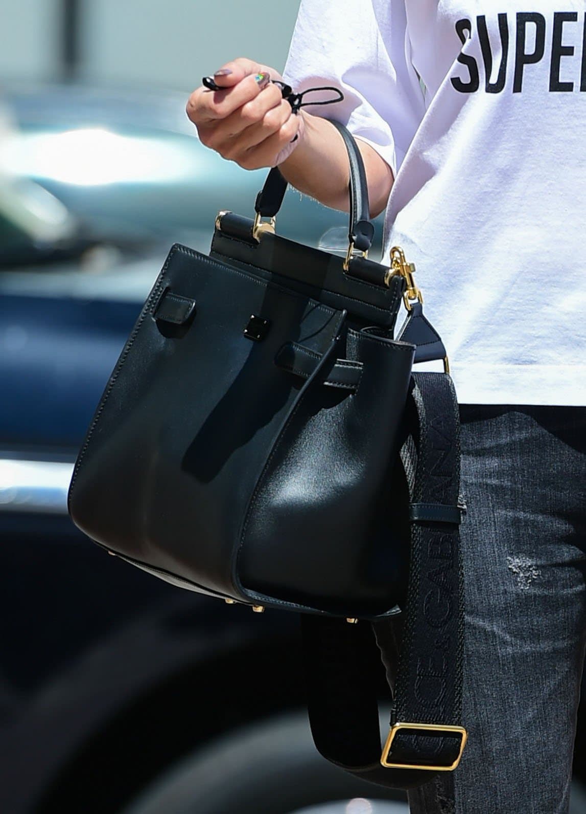 Heidi Klum carries a black Dolce & Gabbana Sicily handbag