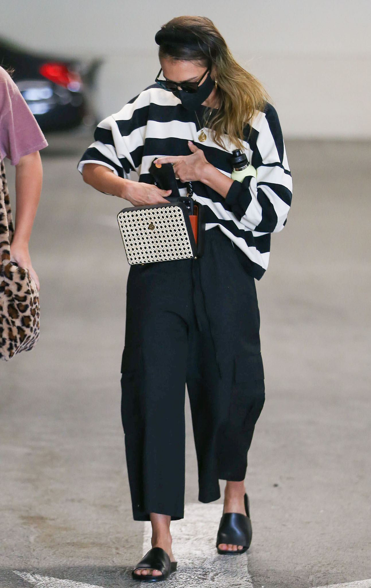 Jessica Alba goes for cool-mom style in Rebecca Minkoff Rosie striped sweatshirt and wide-leg cargo pants