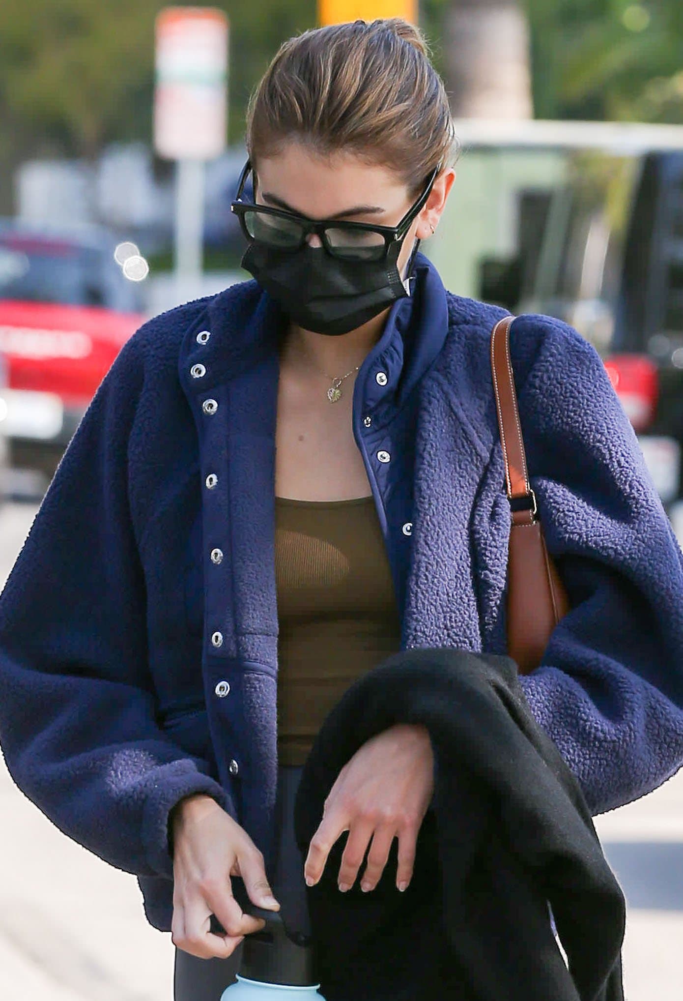 Kaia Gerber looks chic in her geeky black-framed sunglasses