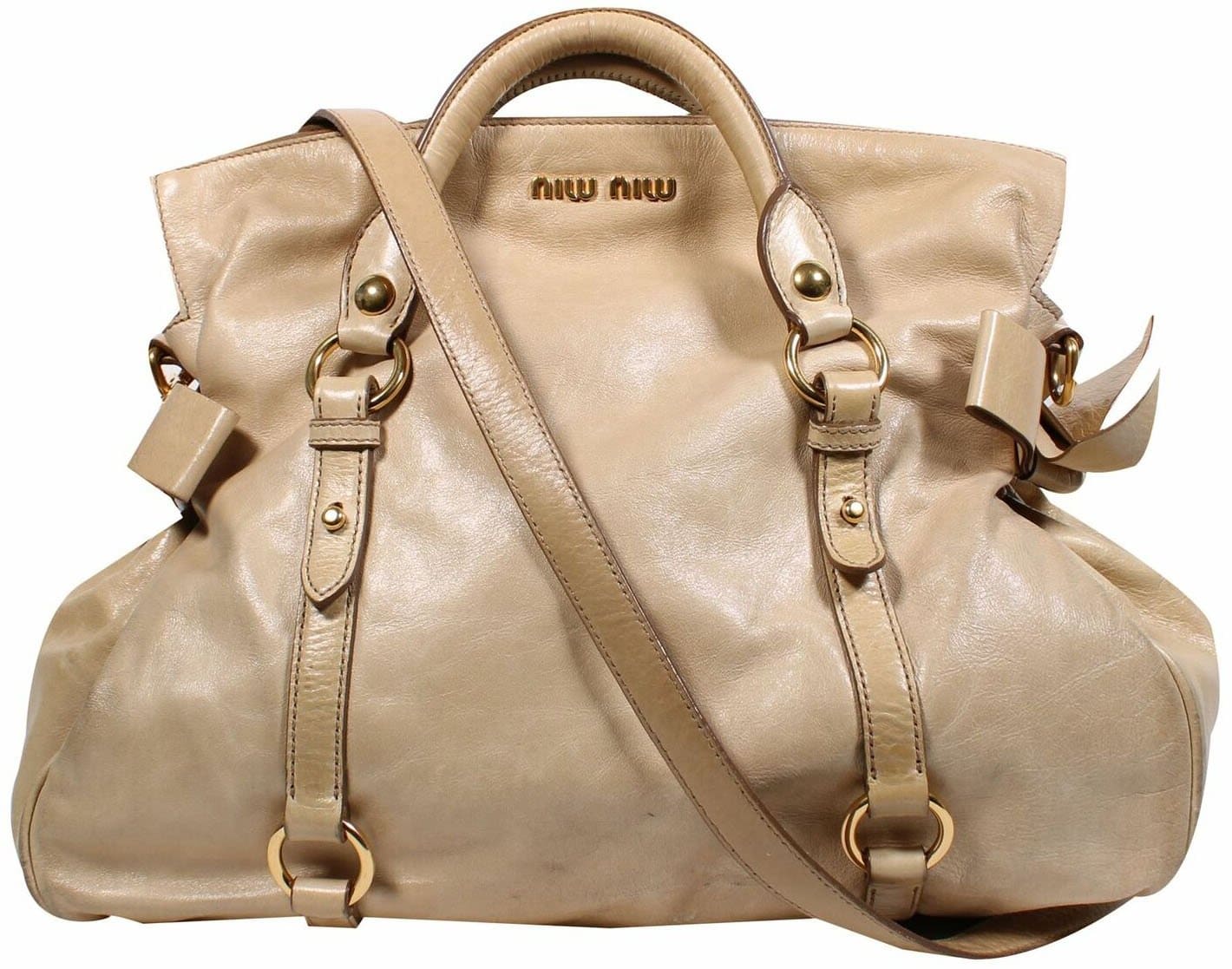 Miu Miu's classic Vitello Bow bag features rolled double top handles with a fold-over top and bow accents on the sides