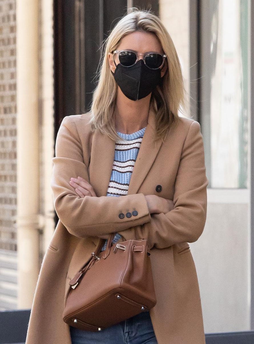 Nicky Hilton covers her face with sunglasses and a face mask and carries a tan Hermes Birkin bag