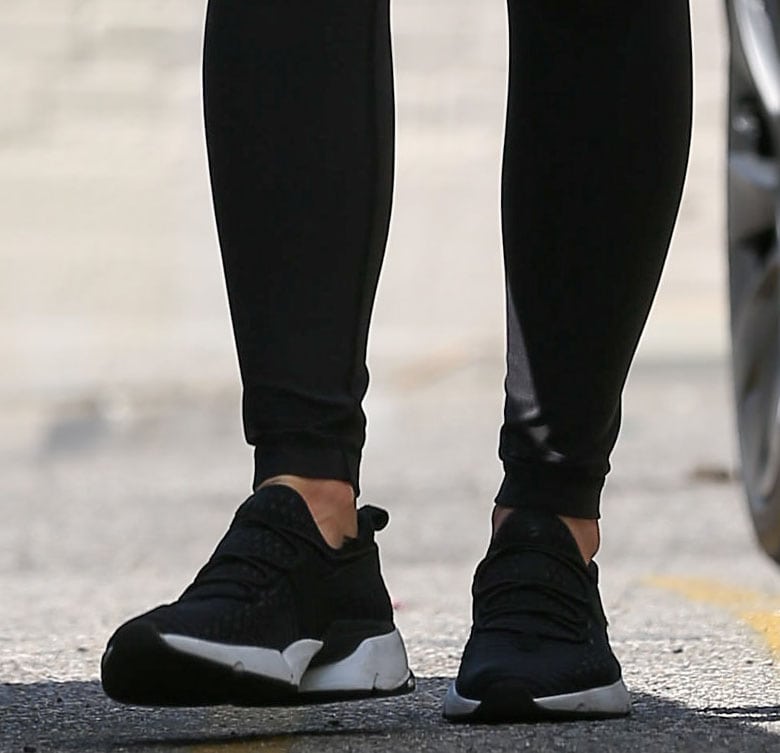 Olivia Munn slips into a pair of dominant black Avre Infinity Glide shoes