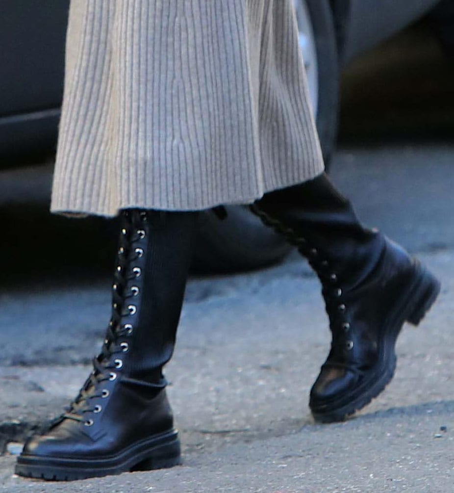 Olivia Palermo completes her stroll outfit with Gianvito Rossi knee-high combat boots