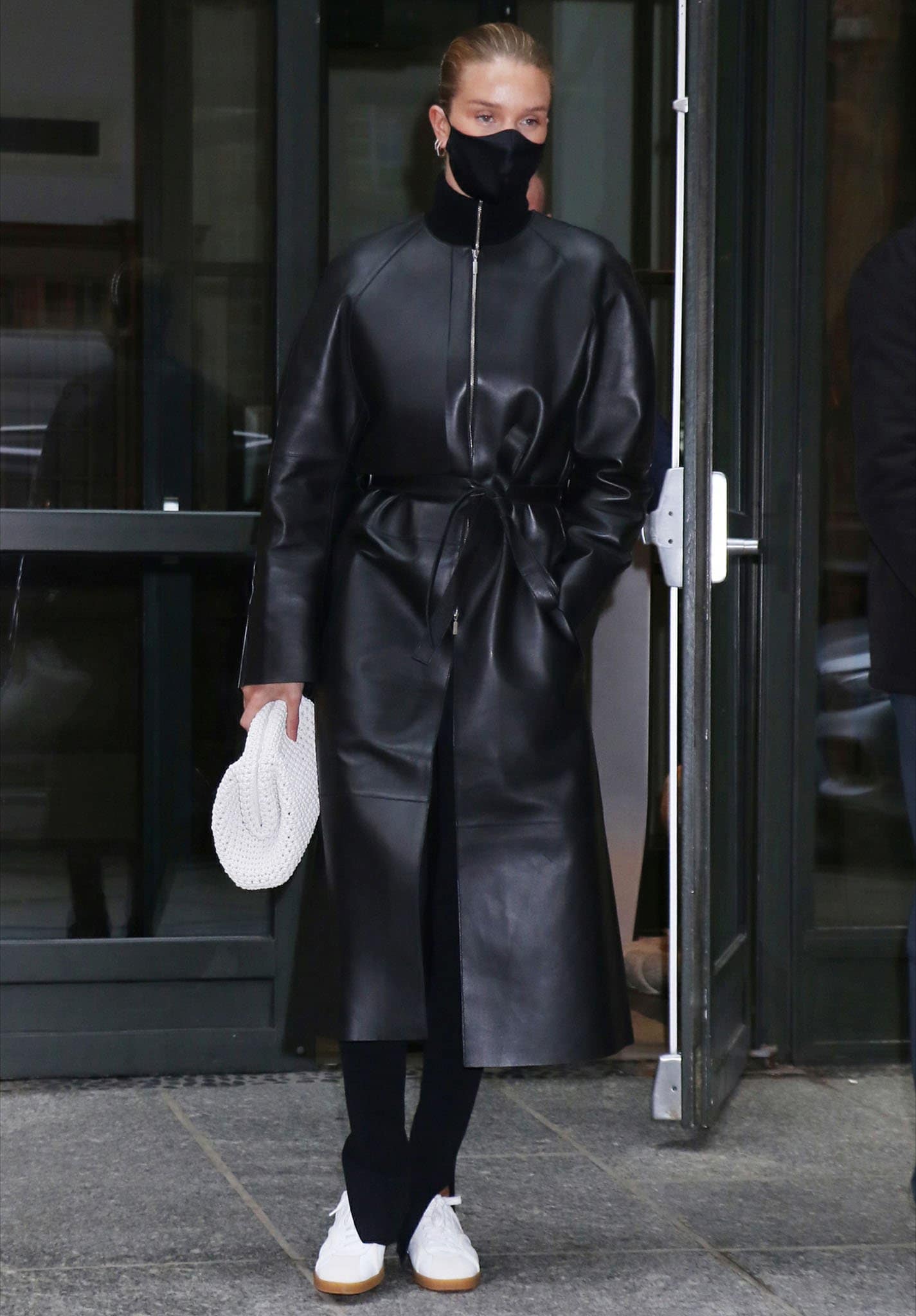 Rosie Huntington-Whiteley in Toteme trench coat, merino wool sweater, and high-rise leggings