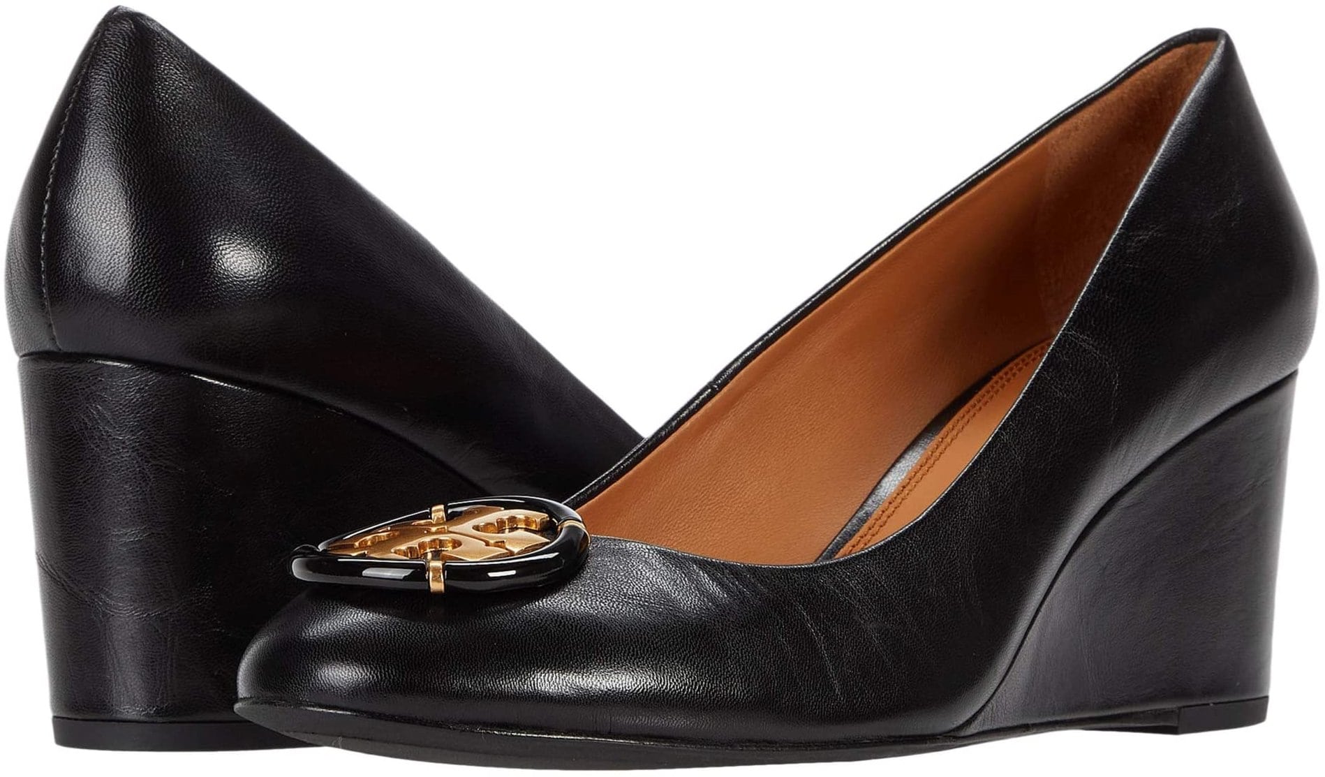 In soft, super-fine leather with a flattering almond toe and a comfortable heel, this polished wedge is perfect for day or evening