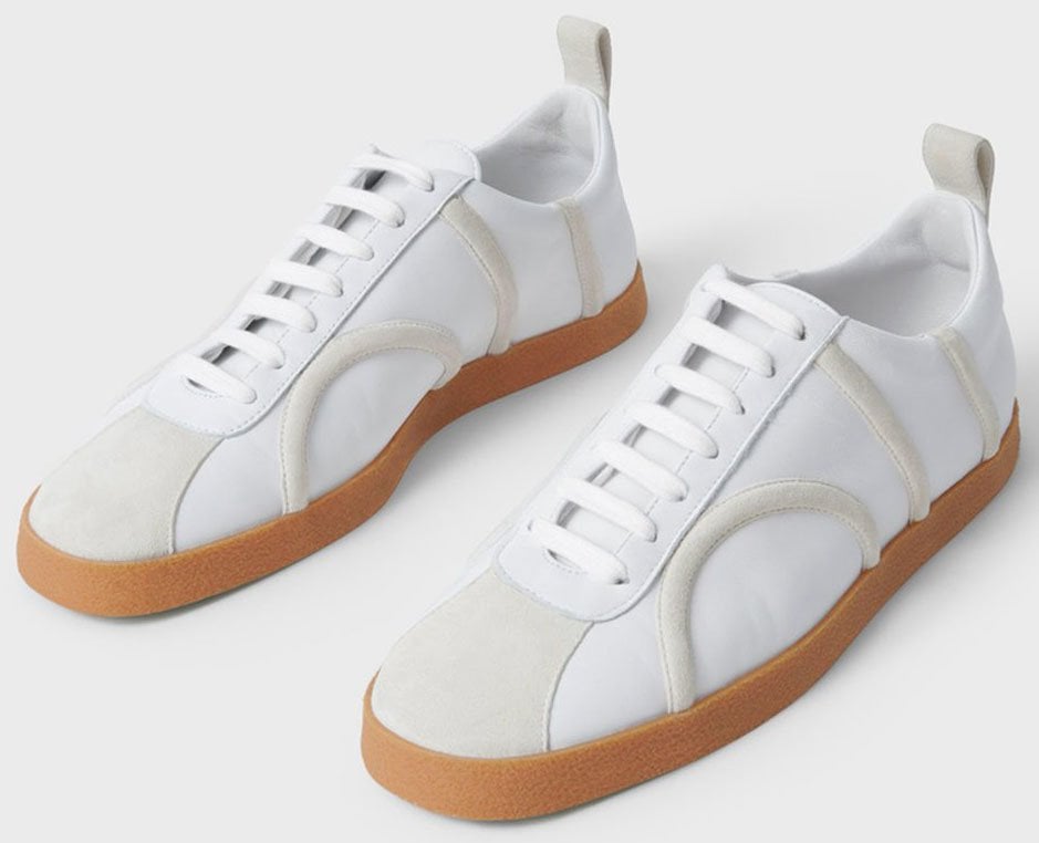 Suede trims and toe panelling add a contemporary design to Toteme's The Sneaker leather shoes