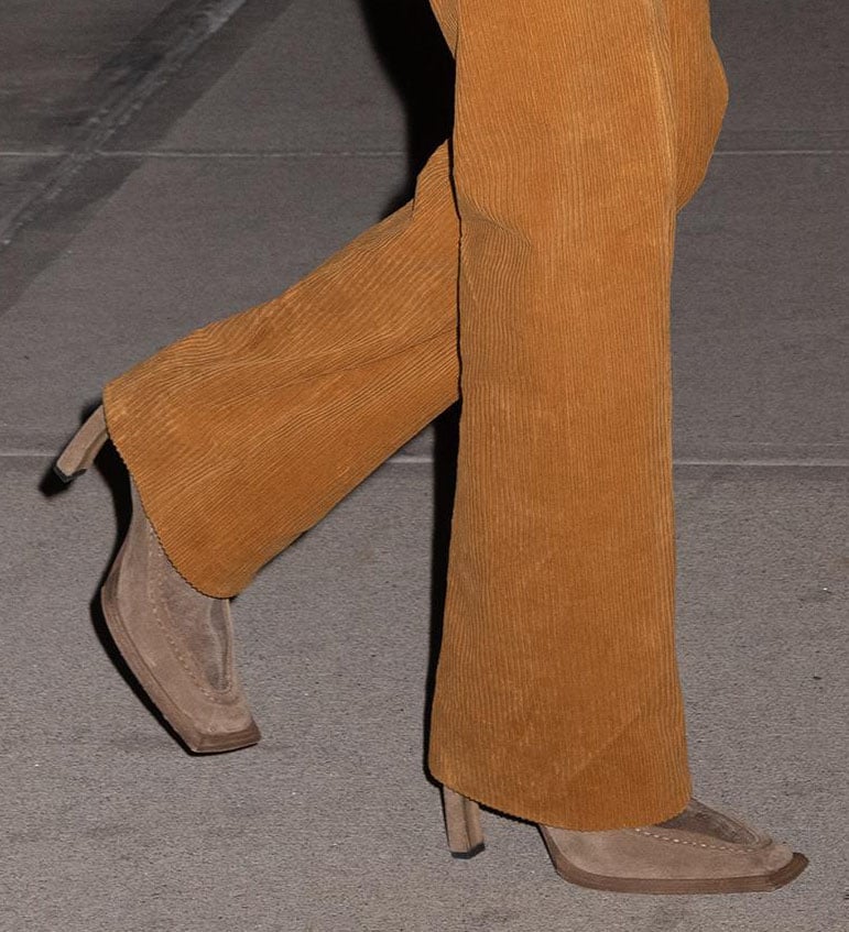 Bella Hadid teams her retro outfit with brown suede square-toed boots