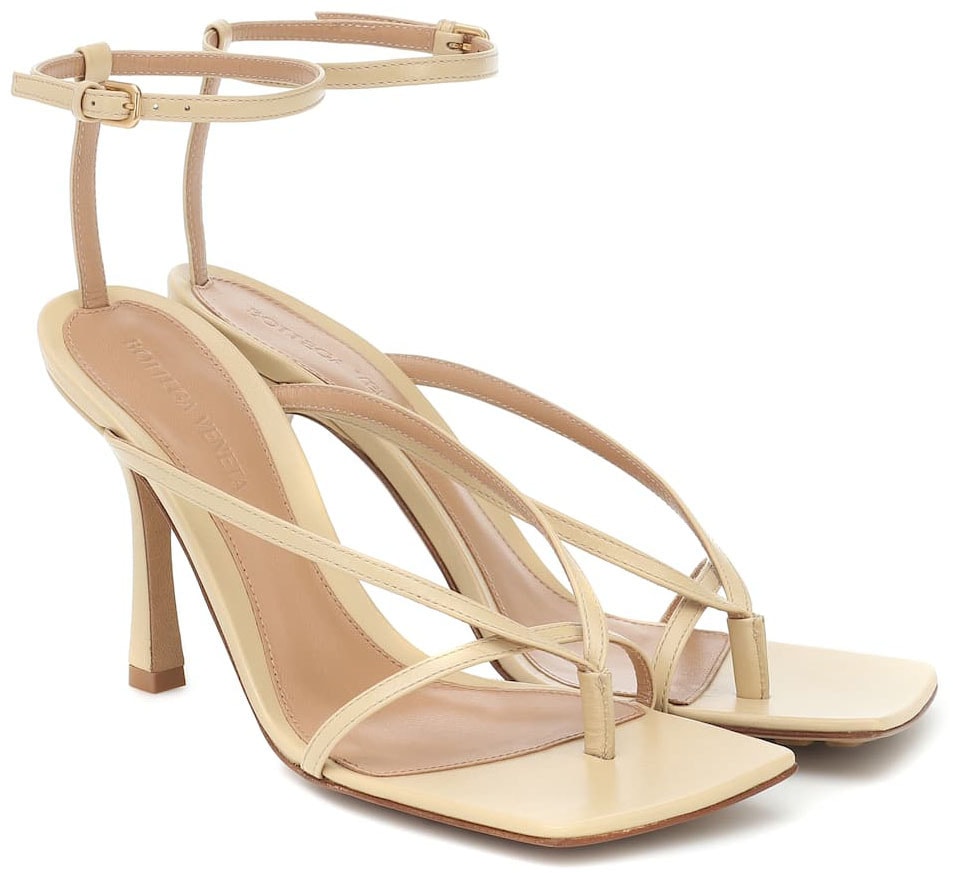 A minimalist pair of sandals with trendy square toes and sculpted heels