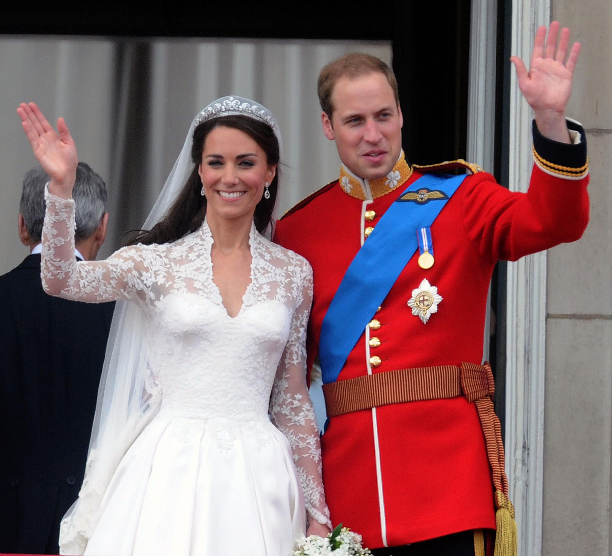 Duchess of Cambridge Kate Middleton wears a white laced wedding gown designed by Sarah Burton for Alexander McQueen in April 2011