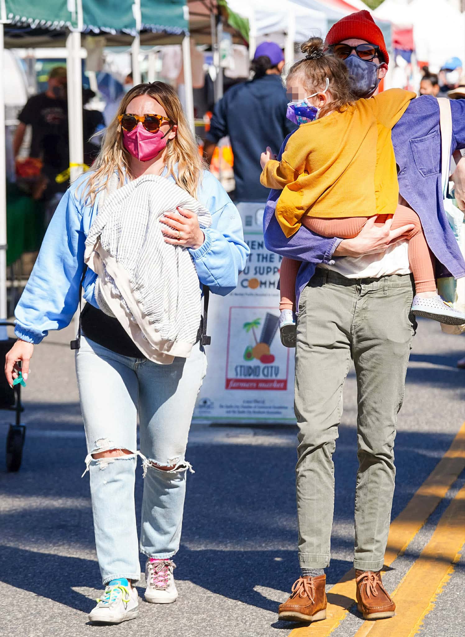 Hilary Duff goes to farmer's market with newborn Mae, husband Matthew Koma, and daughter Banks on May 23, 2021