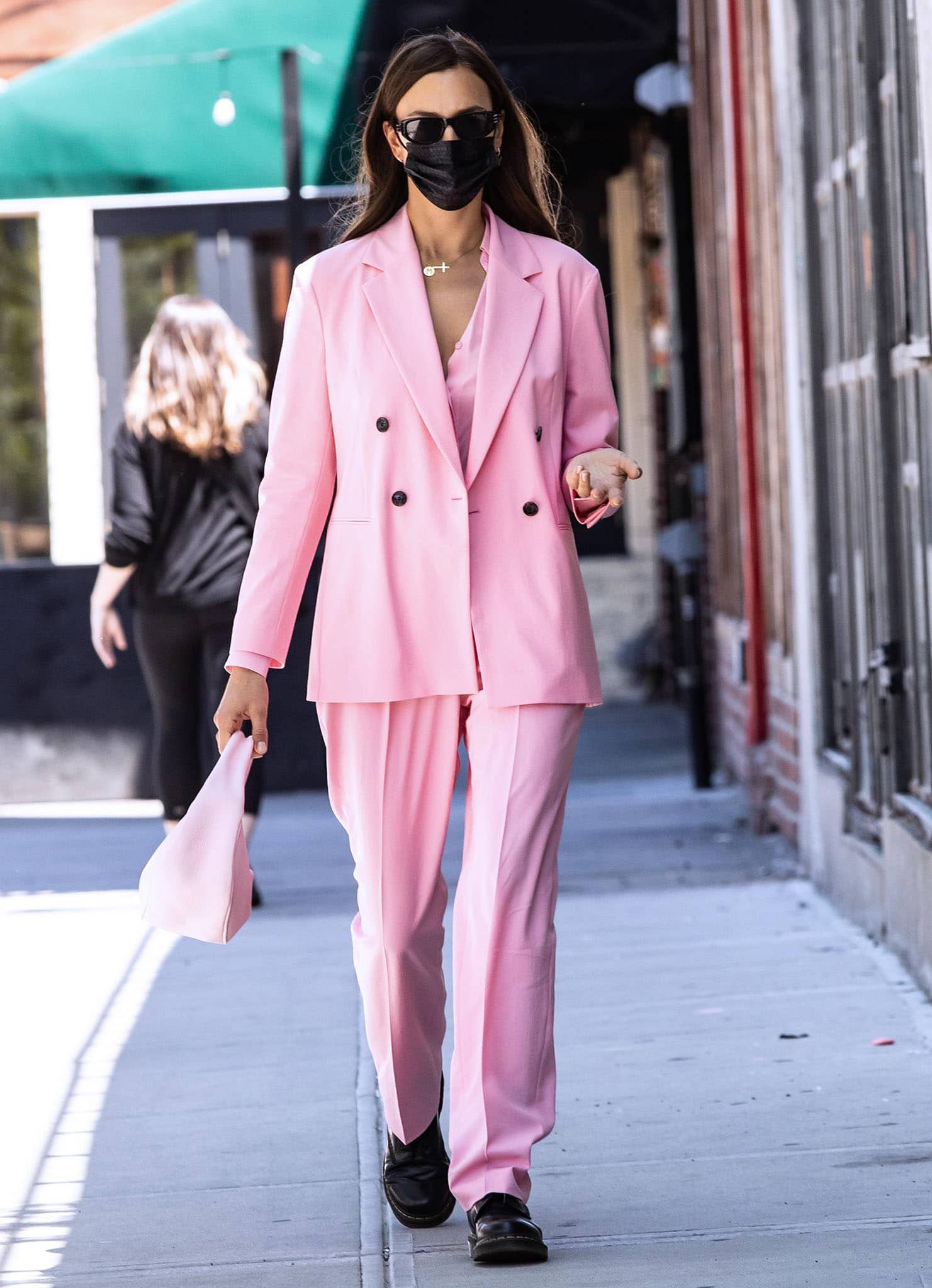 Irina Shayk wears a spring chic bubblegum pink suit from Hugo Boss