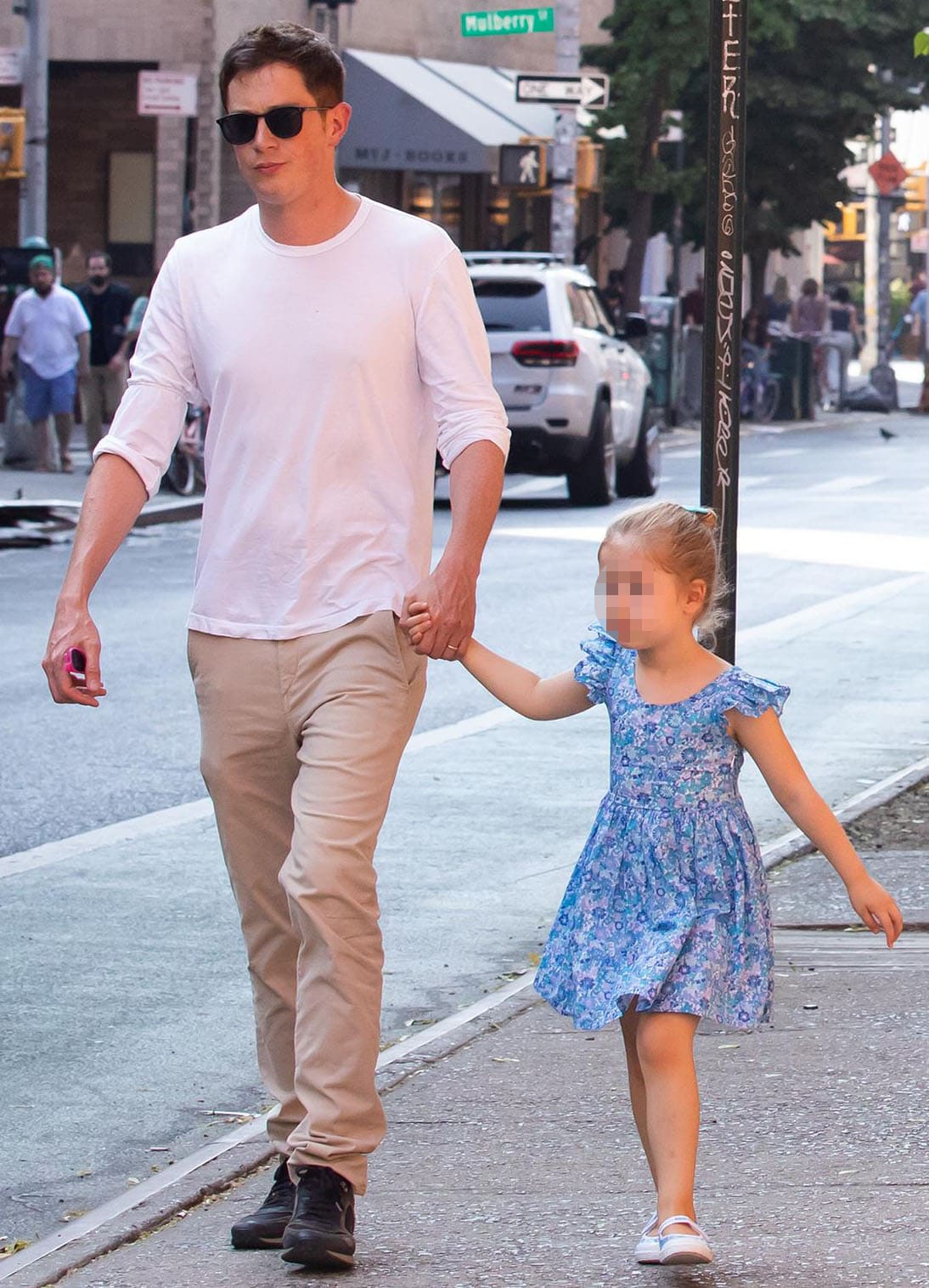 James Rothschild keeps it simple in white tee and khaki pants combo as he holds hands with daughter Lily Grace in floral blue dress and matching shoes