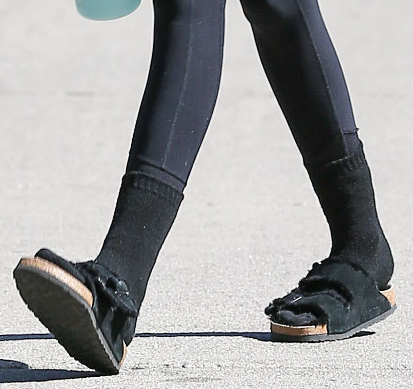 Kaia Gerber teams her Birkenstock Arizona Fur sandals with black socks