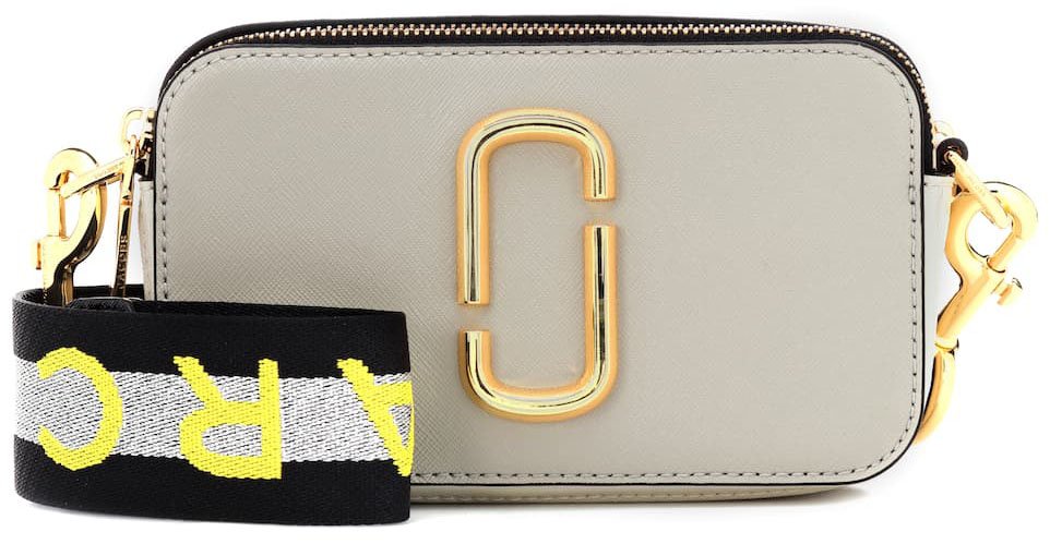 Marc Jacobs Snapshot Small Leather Camera Bag, a stylish and compact accessory featuring a bold logo and adjustable strap for everyday elegance