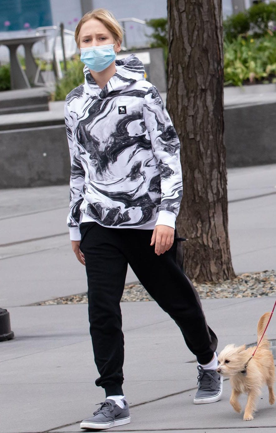 Naomi Watts' eldest son Alexander keeps it cool with a swirl-print hoodie and jogger pants