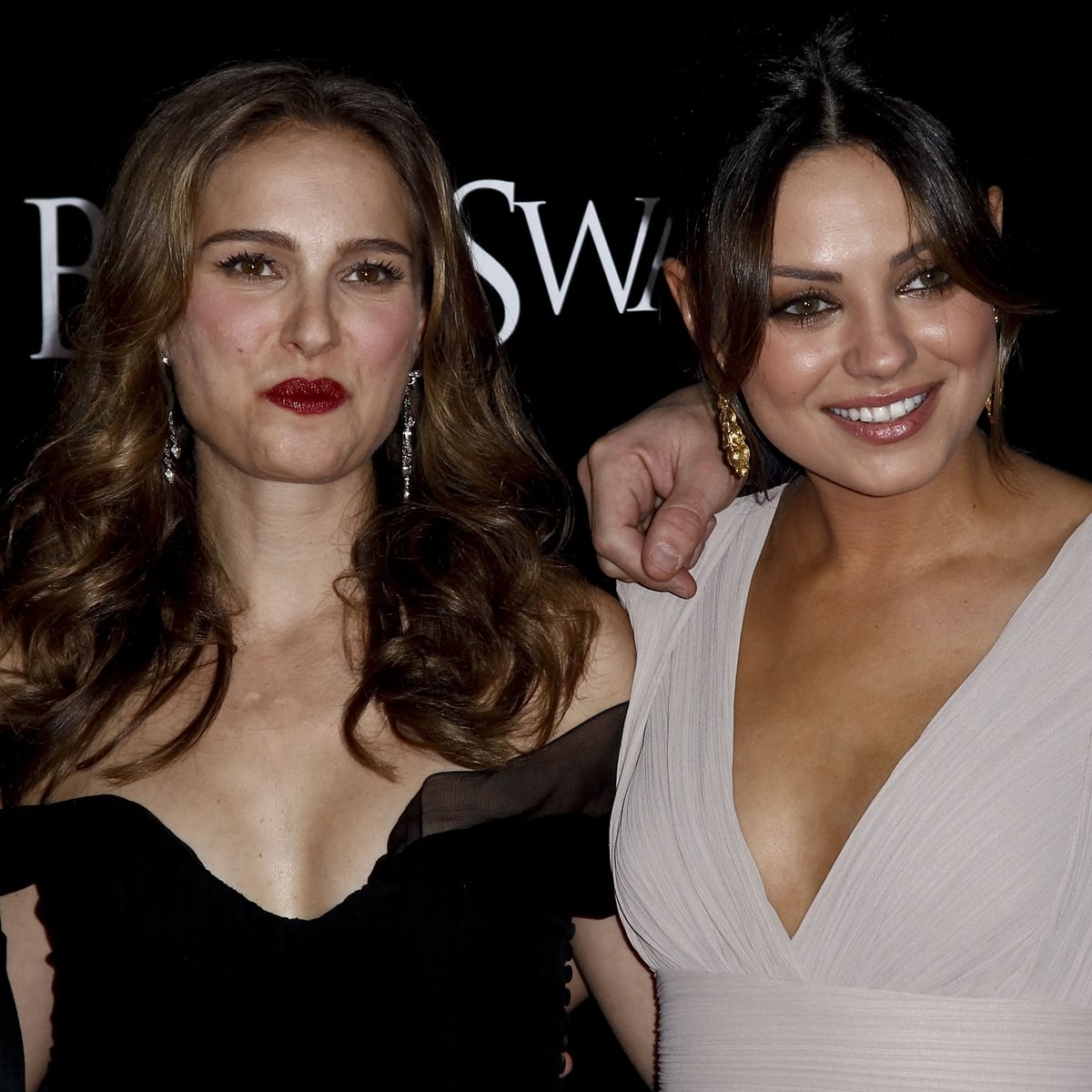 Natalie Portman in an elegant off-the-shoulder black gown and Mila Kunis in a plunging beige dress at the Black Swan premiere