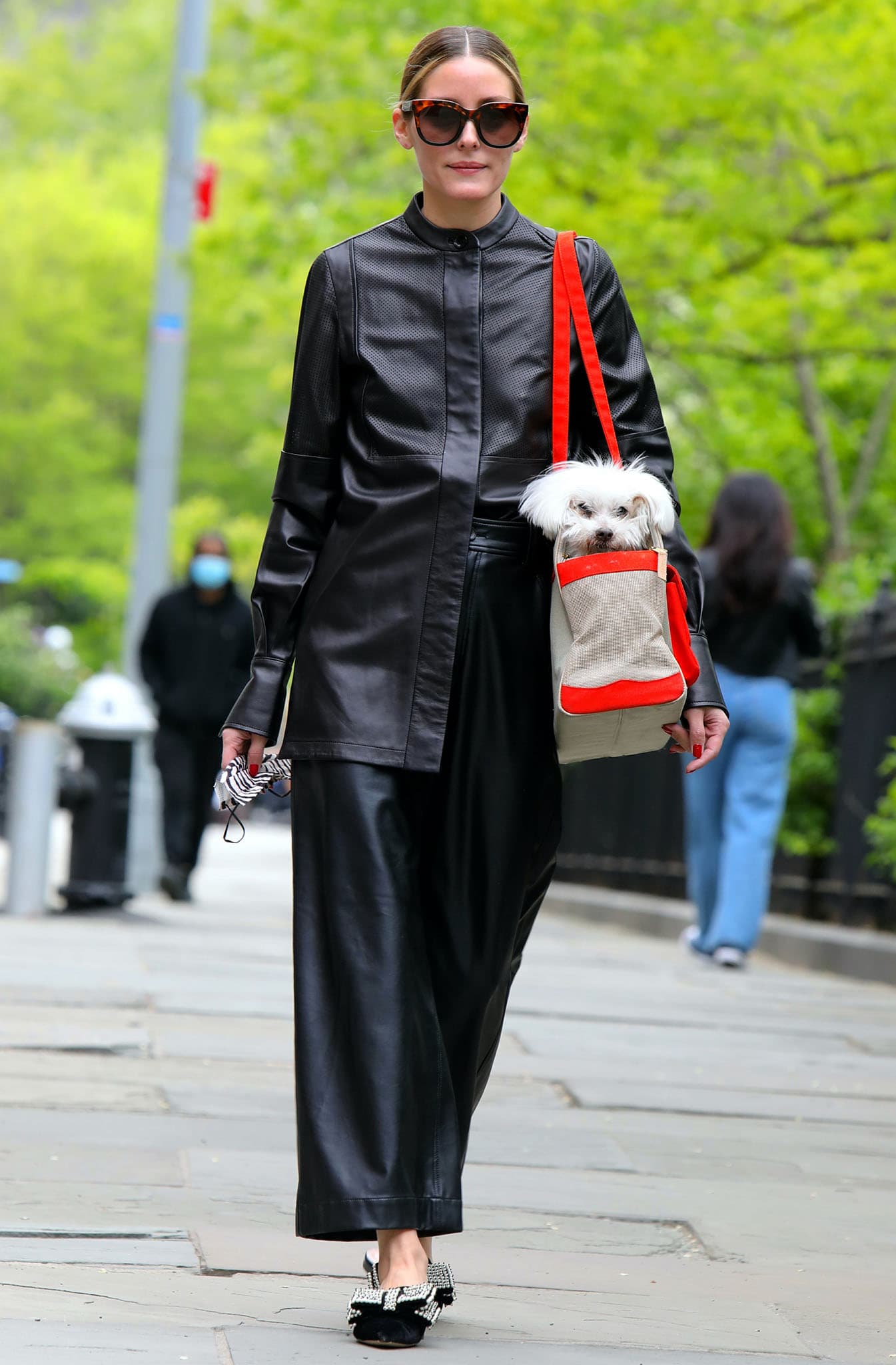 Olivia Palermo goes head-to-toe black in her perforated leather tunic and Tibi leather culottes