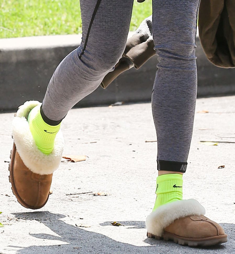 Sofia Boutella wears neon green socks with UGG Coquette slippers