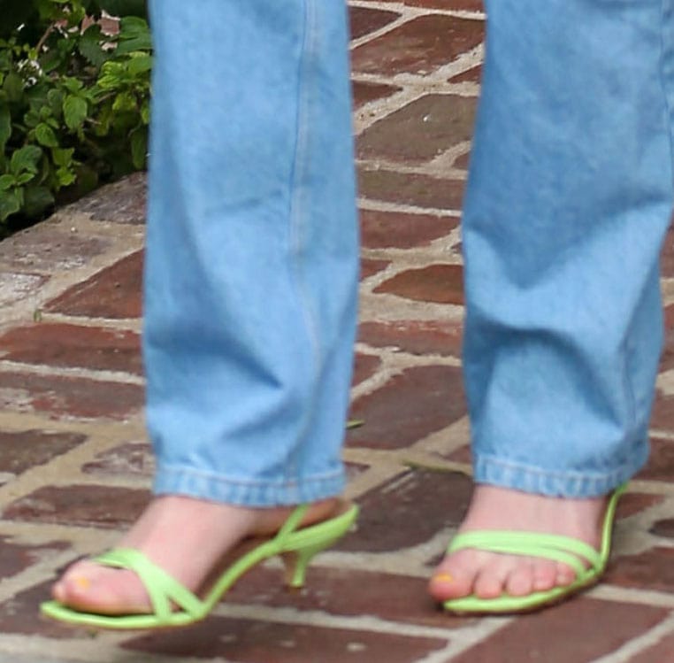 Sophie Turner completes a '90s chic look with lime green Paloma Wool sandals