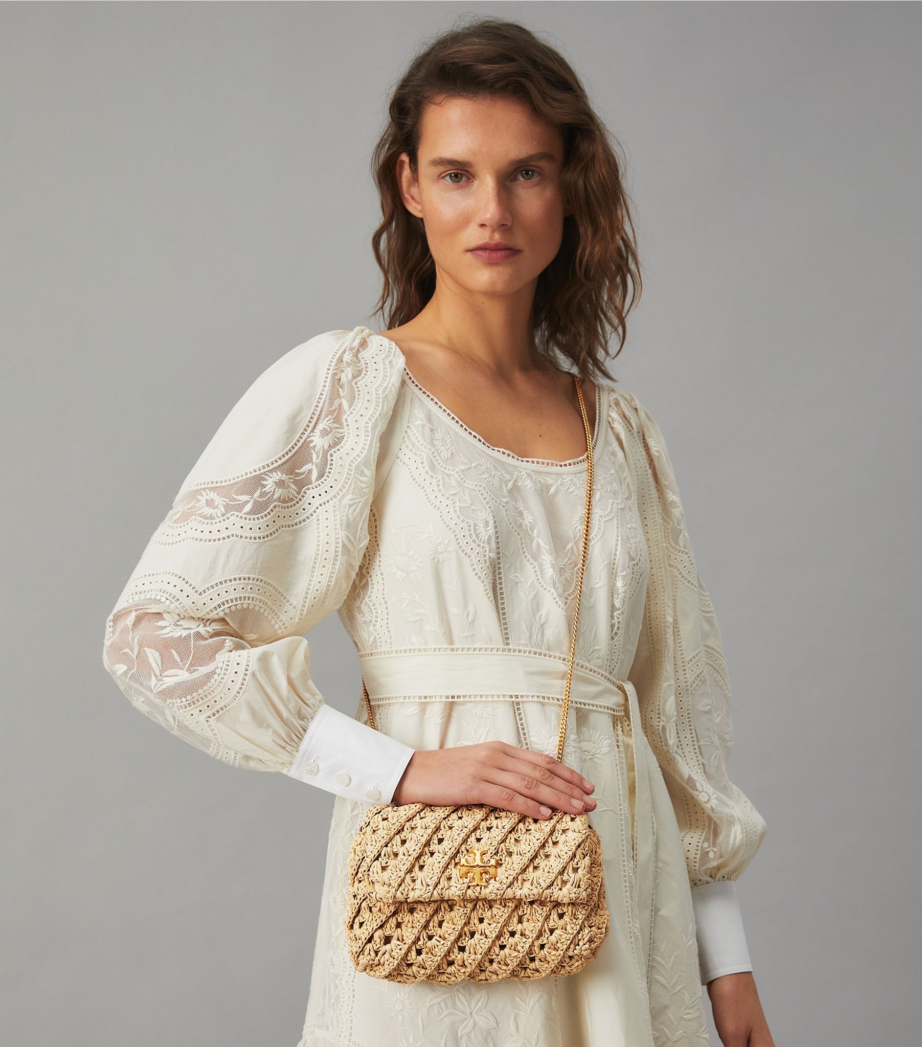 The Kira bag is made from crocheted natural raffia and features the label's double T logo