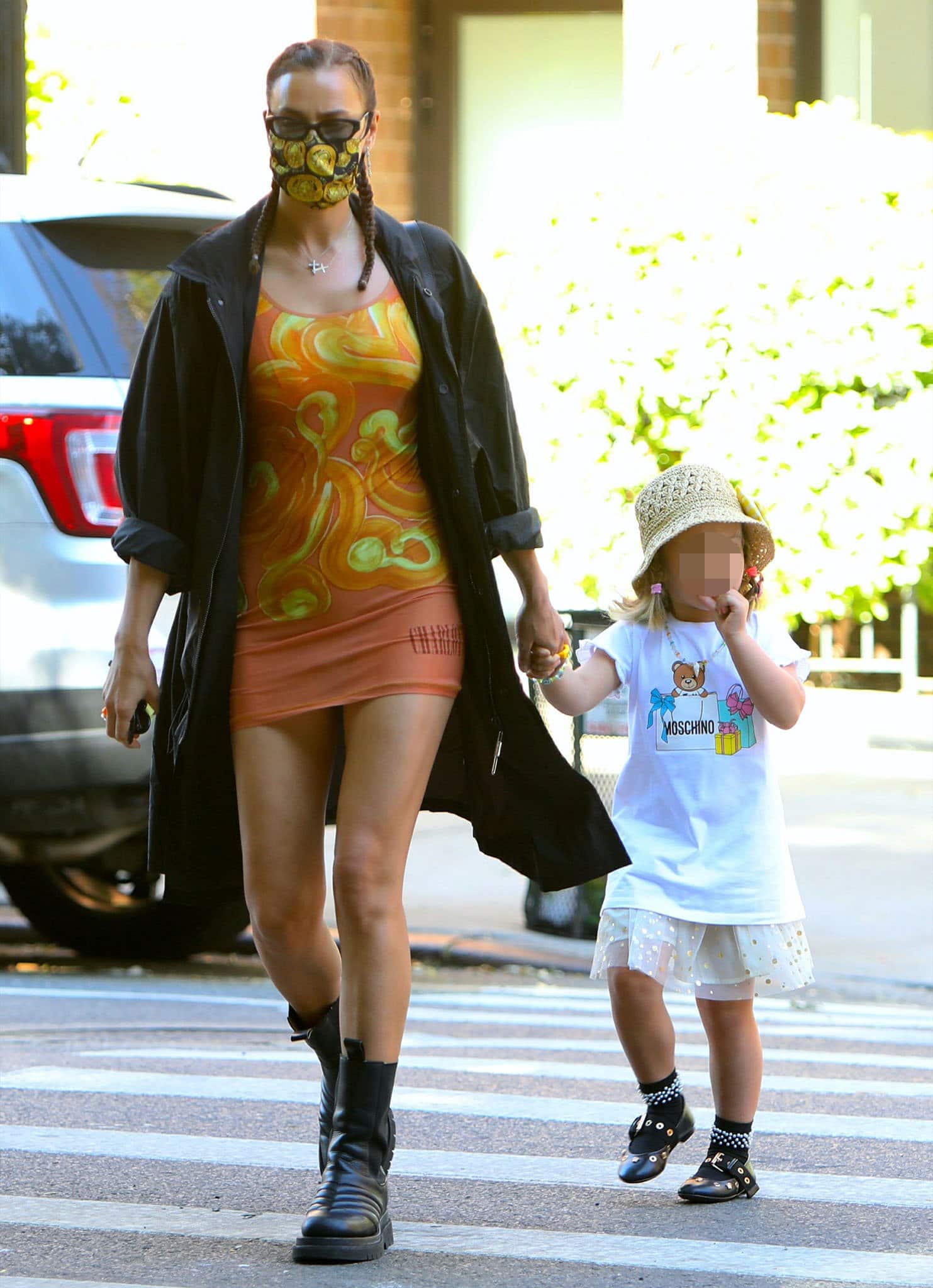 Irina Shayk strolls with Lea in Charlotte Knowles stretch jersey dress and 032C long parka