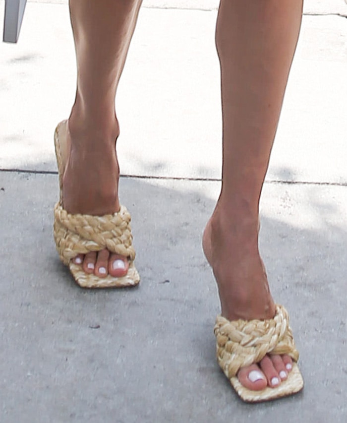 Alessandra Ambrosio completes her chic summer look with Bottega Veneta raffia slide sandals