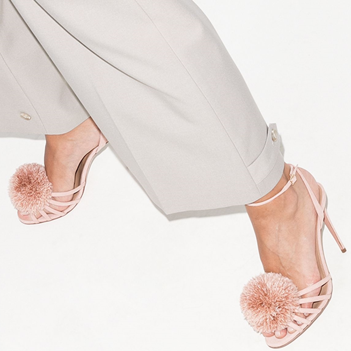 These pink Aquazzura X Browns 50 120 pom-pom leather sandals have been made in Italy