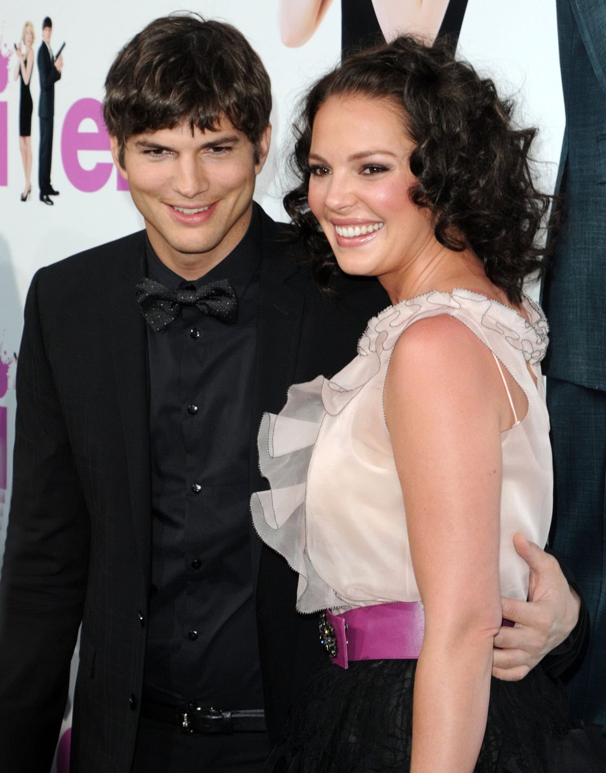 Ashton Kutcher and Katherine Heigl smile brightly on the red carpet at the premiere of "Killers"