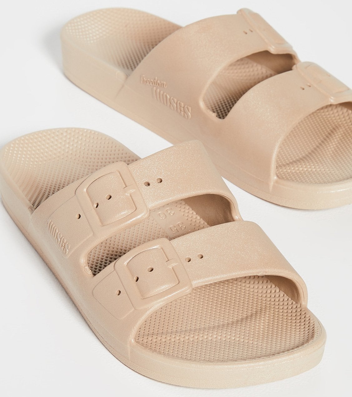 Freedom Moses' Moses slides are vegan and waterproof and have the signature milk and honey scent