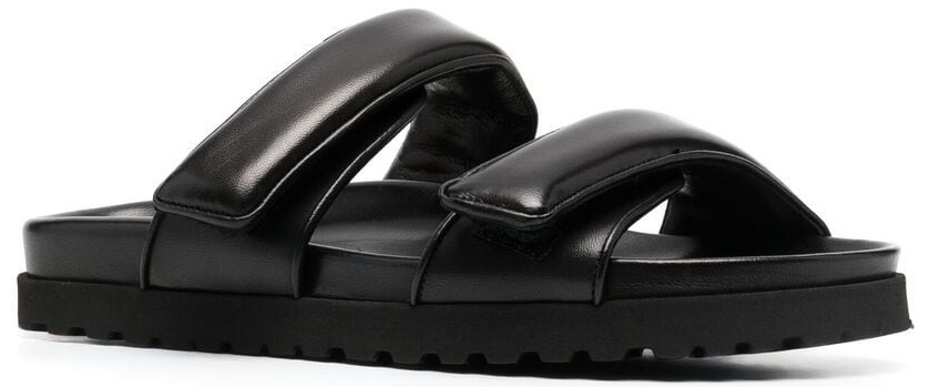 A comfortable pair of slides with smooth padded leather straps