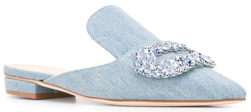 A simple pair of denim mules jazzed up with a large crystal buckle accent