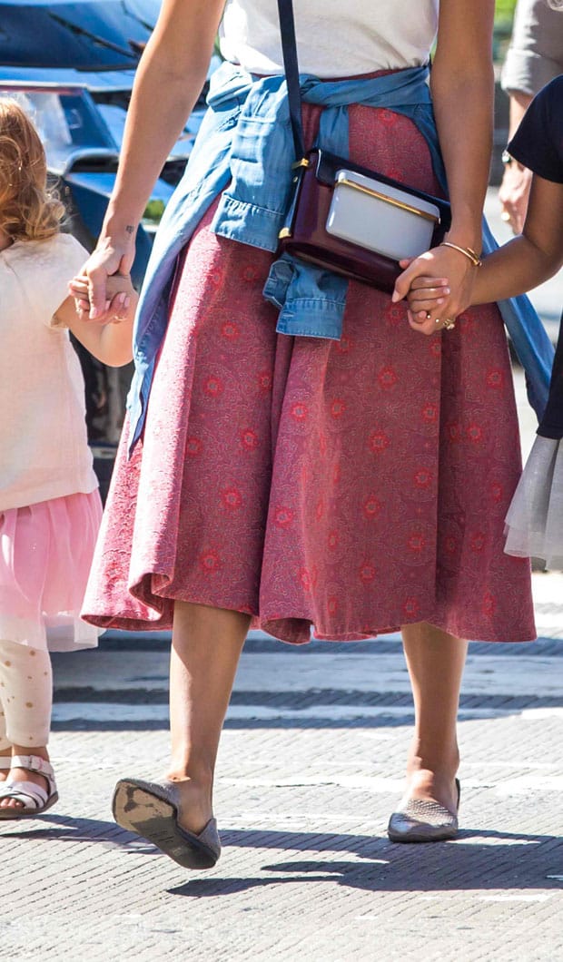Jessica Alba styled a circled pink textured pattern H&M midi skirt with flats and a colorful Mary Katrantzou MVK Medium satchel crossbody bag