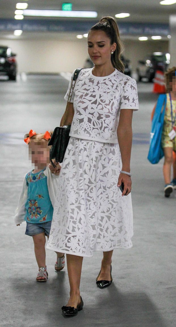 Jessica Alba, in a white floral dress and flat shoes, holds hands with daughter Haven Warren as she takes her children to the Hammer Museum of Art in Los Angeles on May 18, 2014